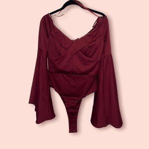 Burgundy bodysuit, flared arms and v-neck.